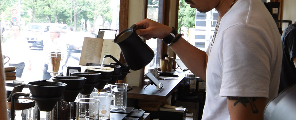 BARISTA USING POUR OVER KETTLE TO BREW COFFEE  BANNER
